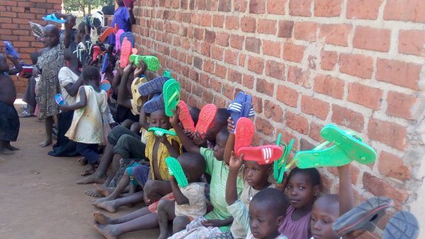 Giving out shoes 