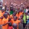 Safo children waving. 