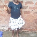 Favor feeling high in her new skirt and top blouse.