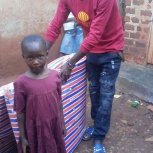 Favour receiving  her new mattress. 