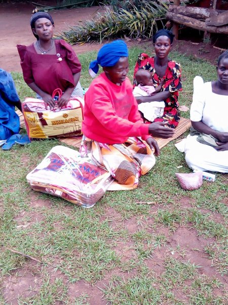 Widows receiving seeds, blankets & bibles