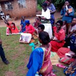 Widows receiving seeds, blankets & bibles