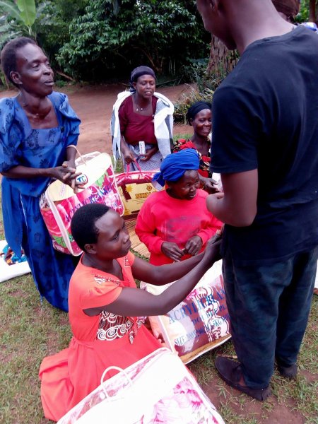 Widows receiving seeds, blankets & bibles