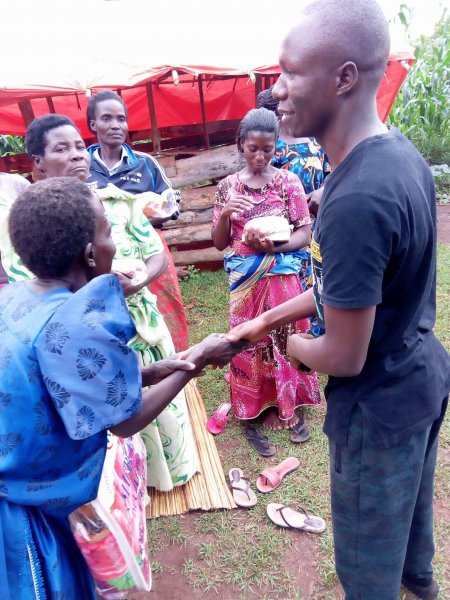 Widows receiving seeds, blankets & bibles