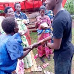 Widows receiving seeds, blankets & bibles