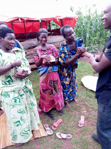 Widows receiving seeds, blankets & bibles