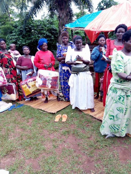 Widows receiving seeds, blankets & bibles