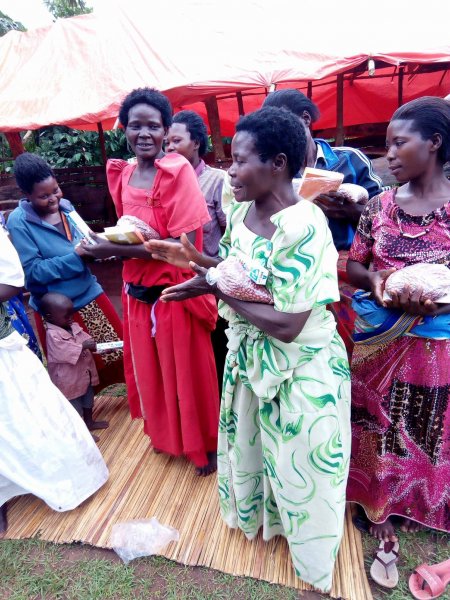 Widows receiving seeds, blankets & bibles
