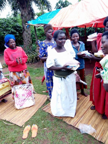 Widows receiving seeds, blankets & bibles
