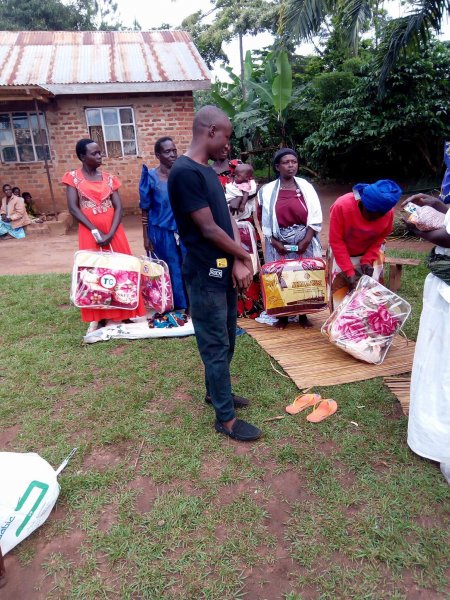 Widows receiving seeds, blankets & bibles