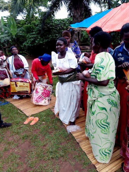 Widows receiving seeds, blankets & bibles