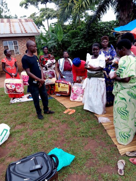 Widows receiving seeds, blankets & bibles