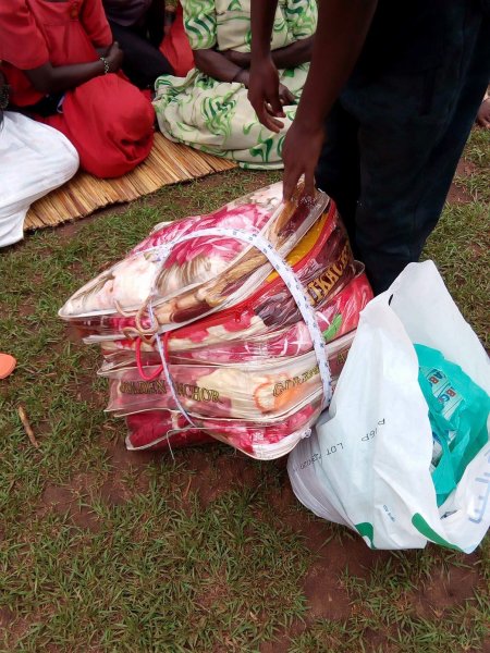 Widows receiving seeds, blankets & bibles