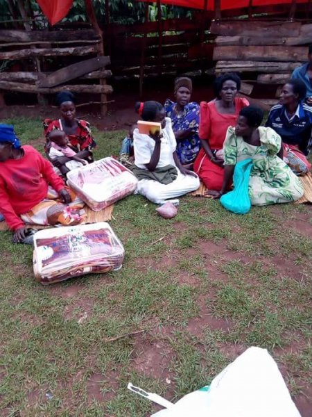 Widows receiving seeds, blankets & bibles