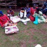 Widows receiving seeds, blankets & bibles