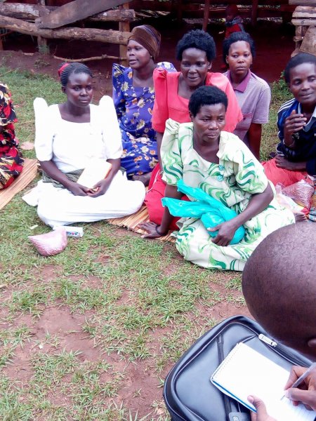 Widows receiving seeds, blankets & bibles