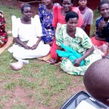 Widows receiving seeds, blankets & bibles