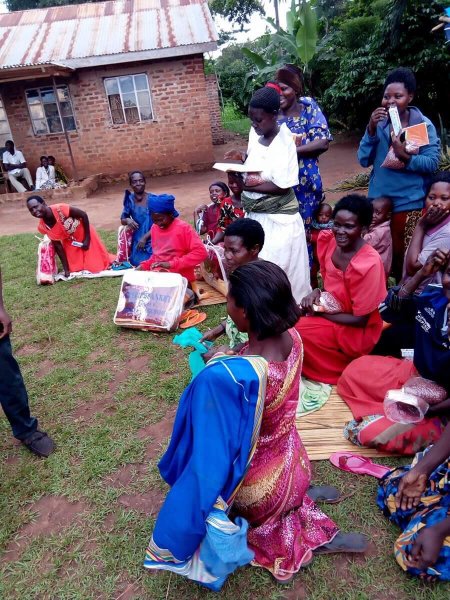Widows receiving seeds, blankets & bibles