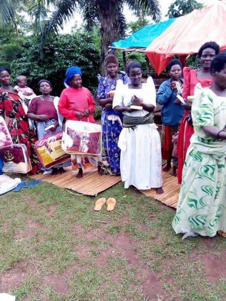 Widows receiving seeds, blankets & bibles