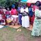 Widows receiving seeds, blankets & bibles