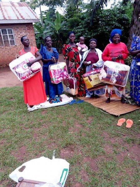 Widows receiving seeds, blankets & bibles