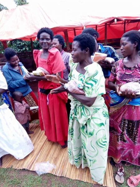 Widows receiving seeds, blankets & bibles