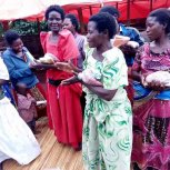 Widows receiving seeds, blankets & bibles