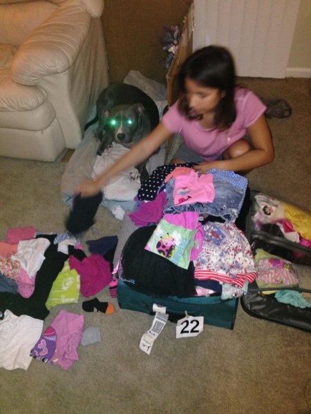 my daughter packing the donated clothes