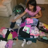 my daughter packing the donated clothes