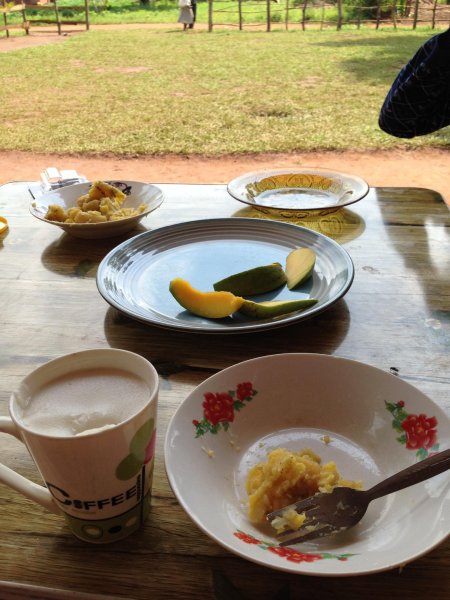 Breakfast porridge, mango and omelette 