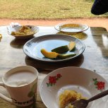 Breakfast porridge, mango and omelette 