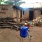 view of back of orphanage with kitchen and eating area