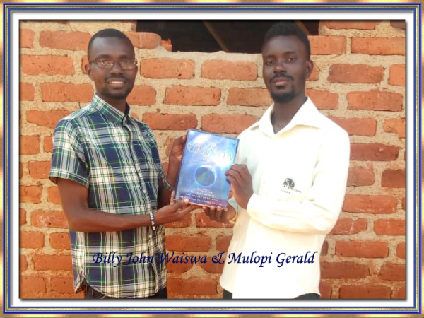  Mulopi Gerald receiving his Urantia Book from Billy John Waiswa September 2019