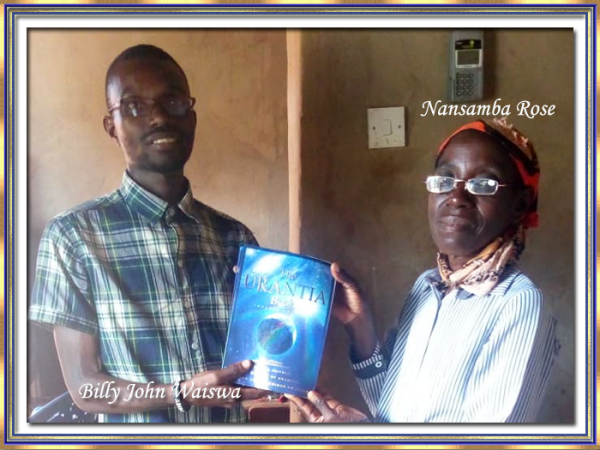  Nansamba Rose receiving her Urantia Book from Billy John Waiswa September 2019