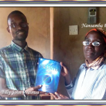  Nansamba Rose receiving her Urantia Book from Billy John Waiswa September 2019