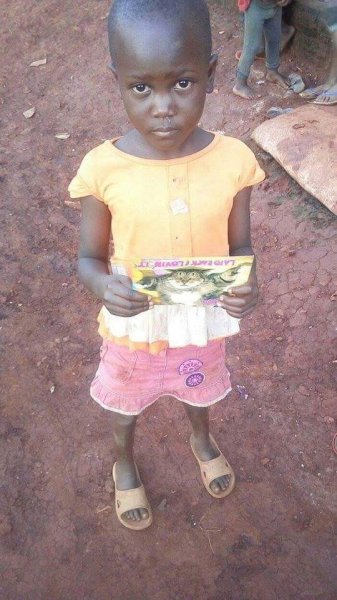 Pictures of two girls receiving letters at Samaritan Foundation Orphanage.