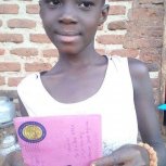 Pictures of two girls receiving letters at Samaritan Foundation Orphanage.
