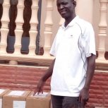 2020-11-15 Uganda Book Deliveries Bishop Moses Kaharwa and Pastor Caroline