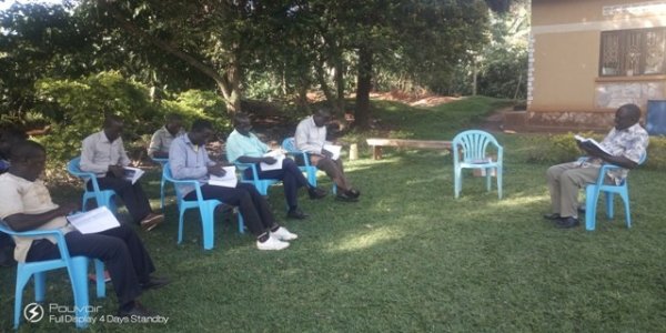 BishopJosephgoingthroughtheurantiabookswiththeDisciples