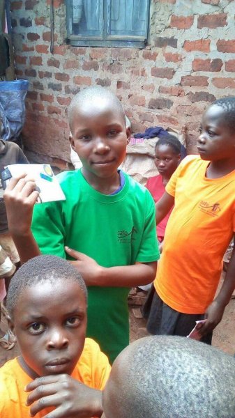 Zuena holding her  letter from sister Monita