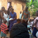 Pastor Caroline Christmas Giving made possible by a generous donor to SFN 2021-12-26 Community of Kaliro Town Council