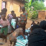 Pastor Caroline Christmas Giving made possible by a generous donor to SFN 2021-12-26 Community of Kaliro Town Council