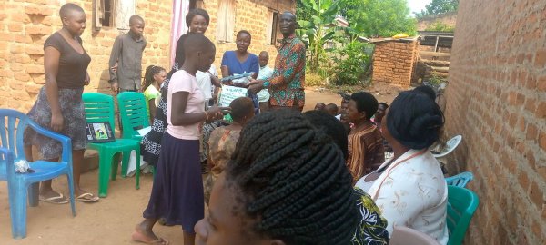 Pastor Caroline Christmas Giving made possible by a generous donor to SFN 2021-12-26 Community of Kaliro Town Council