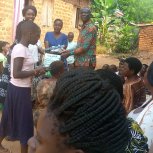 Pastor Caroline Christmas Giving made possible by a generous donor to SFN 2021-12-26 Community of Kaliro Town Council