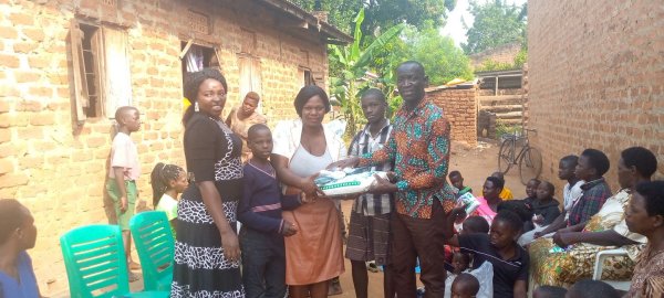 Pastor Caroline Christmas Giving made possible by a generous donor to SFN 2021-12-26 Community of Kaliro Town Council
