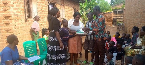 Pastor Caroline Christmas Giving made possible by a generous donor to SFN 2021-12-26 Community of Kaliro Town Council