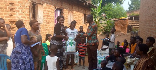 Pastor Caroline Christmas Giving made possible by a generous donor to SFN 2021-12-26 Community of Kaliro Town Council &amp; SEETA-MUKONO