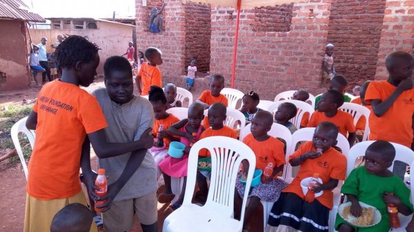 Sharifa helping out this blind little boy