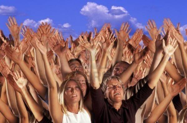 8243422-many-hands-raised-in-worship.jpg